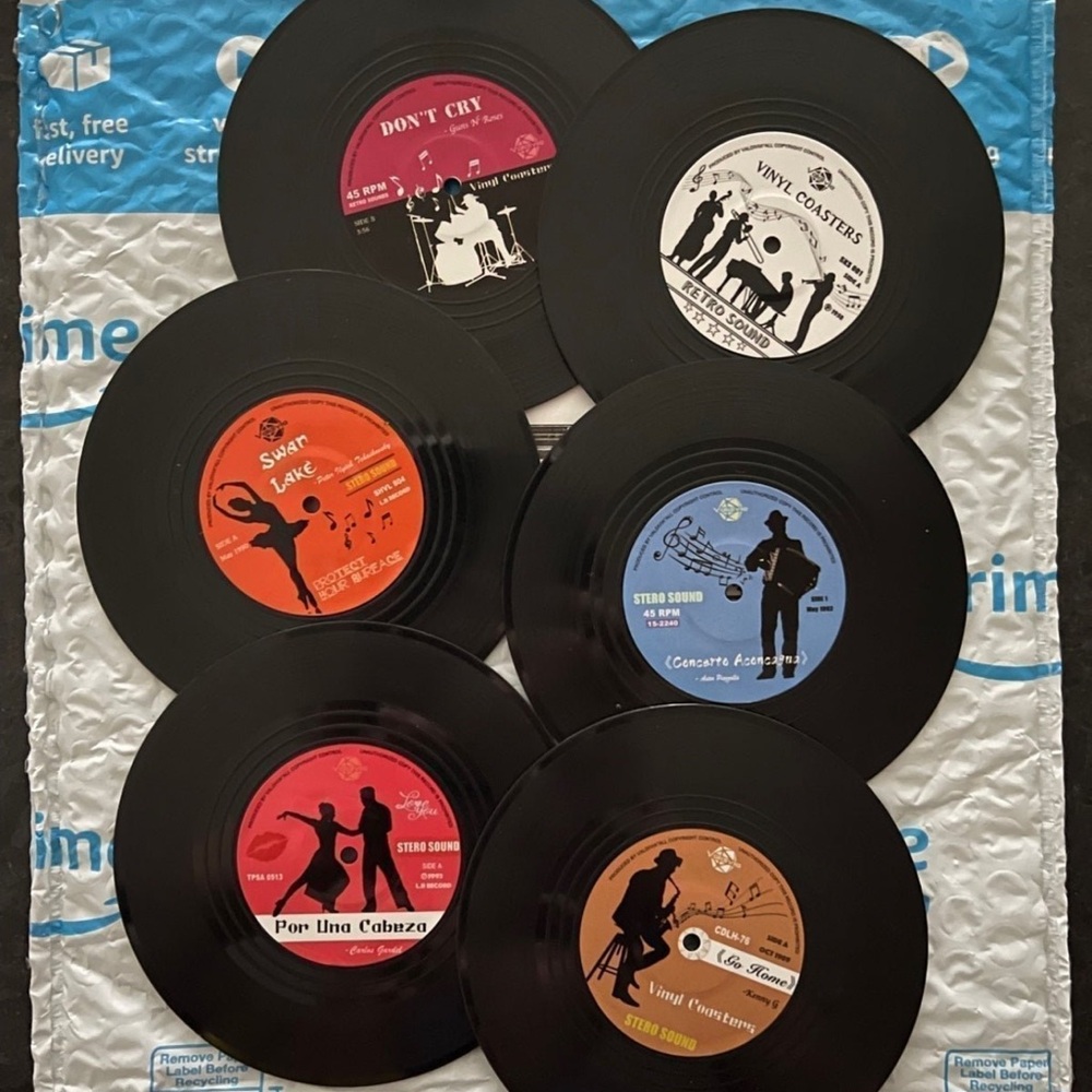 Six (6) assorted 4” vinyl record coasters